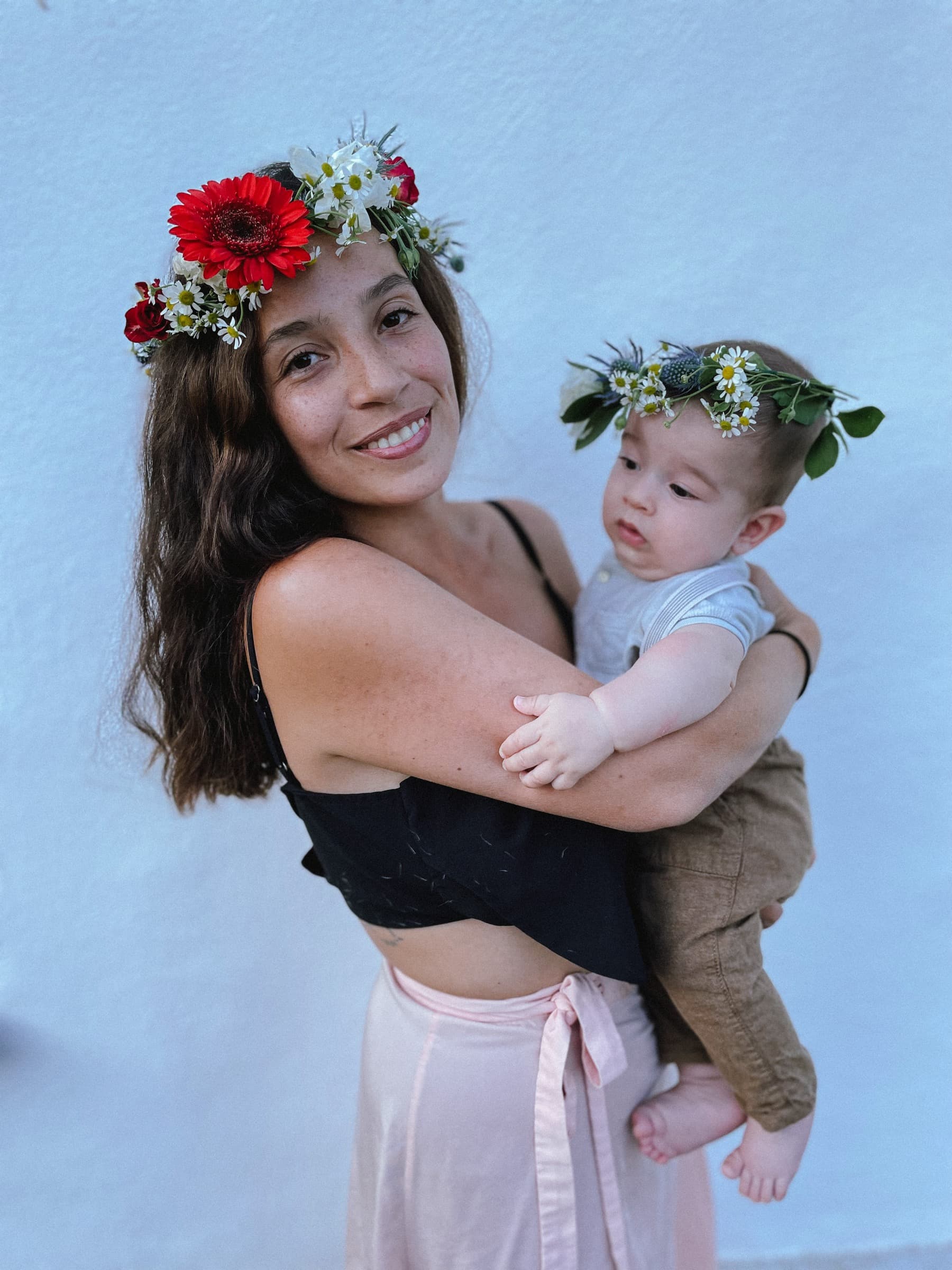 Mother and baby wearing matching handmade flower crowns